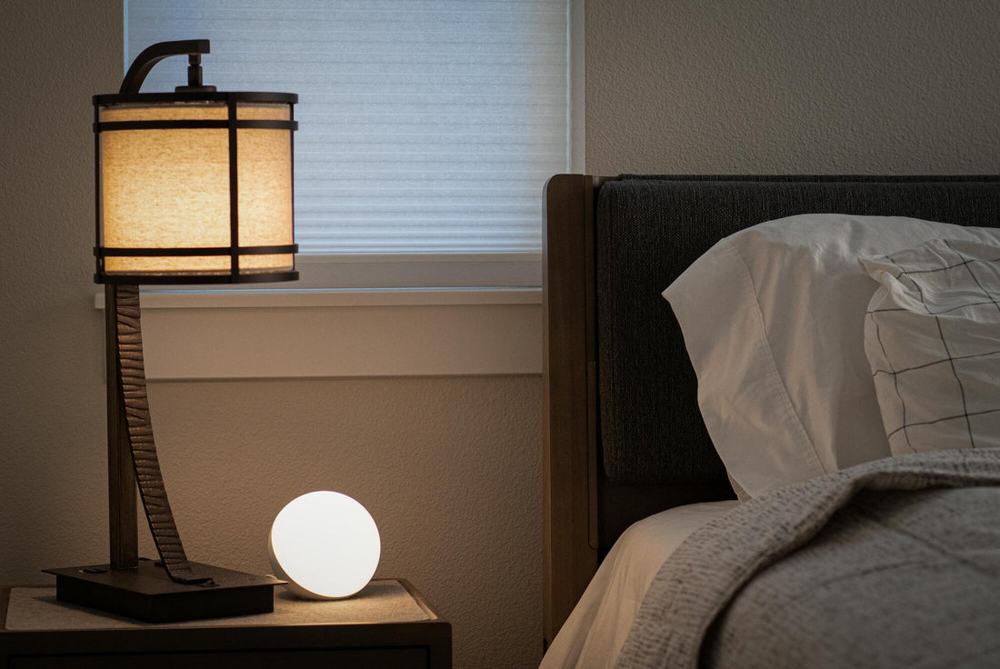 A calm nighttime bedroom scene with soft lighting