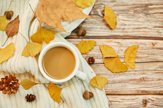 Autumn leaves and a cup of herbal tea.